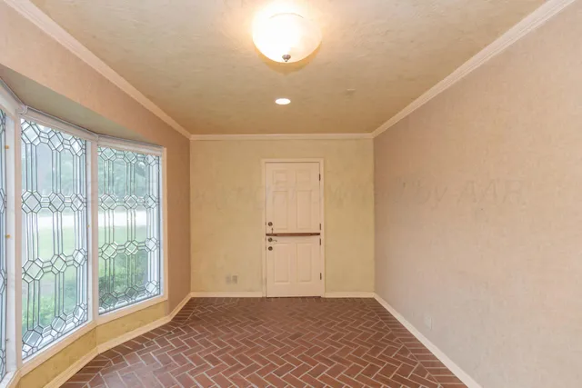 a view of a room with a chandelier and closet