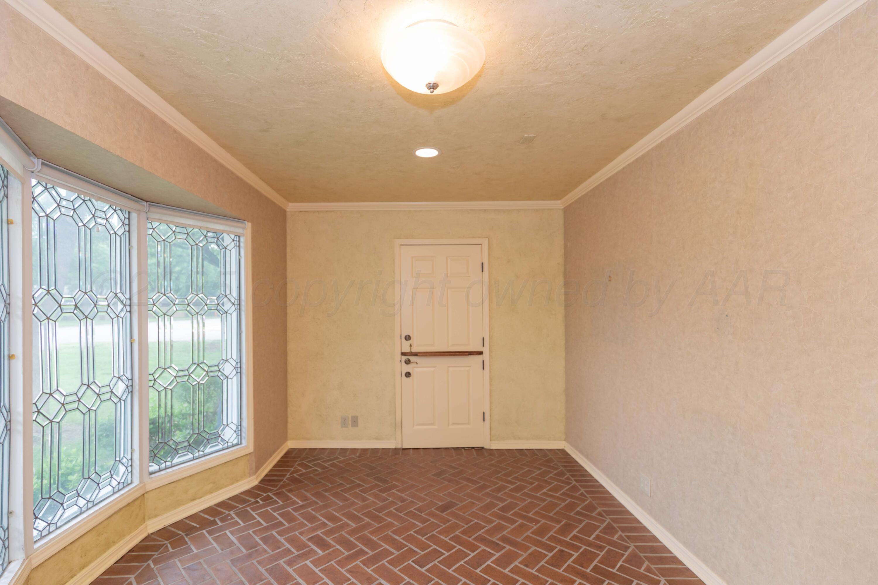 4102 Paramount Boulevard Amarillo, TX 79109 - Photo 29 of 73 a view of empty room with wooden floor and fan
