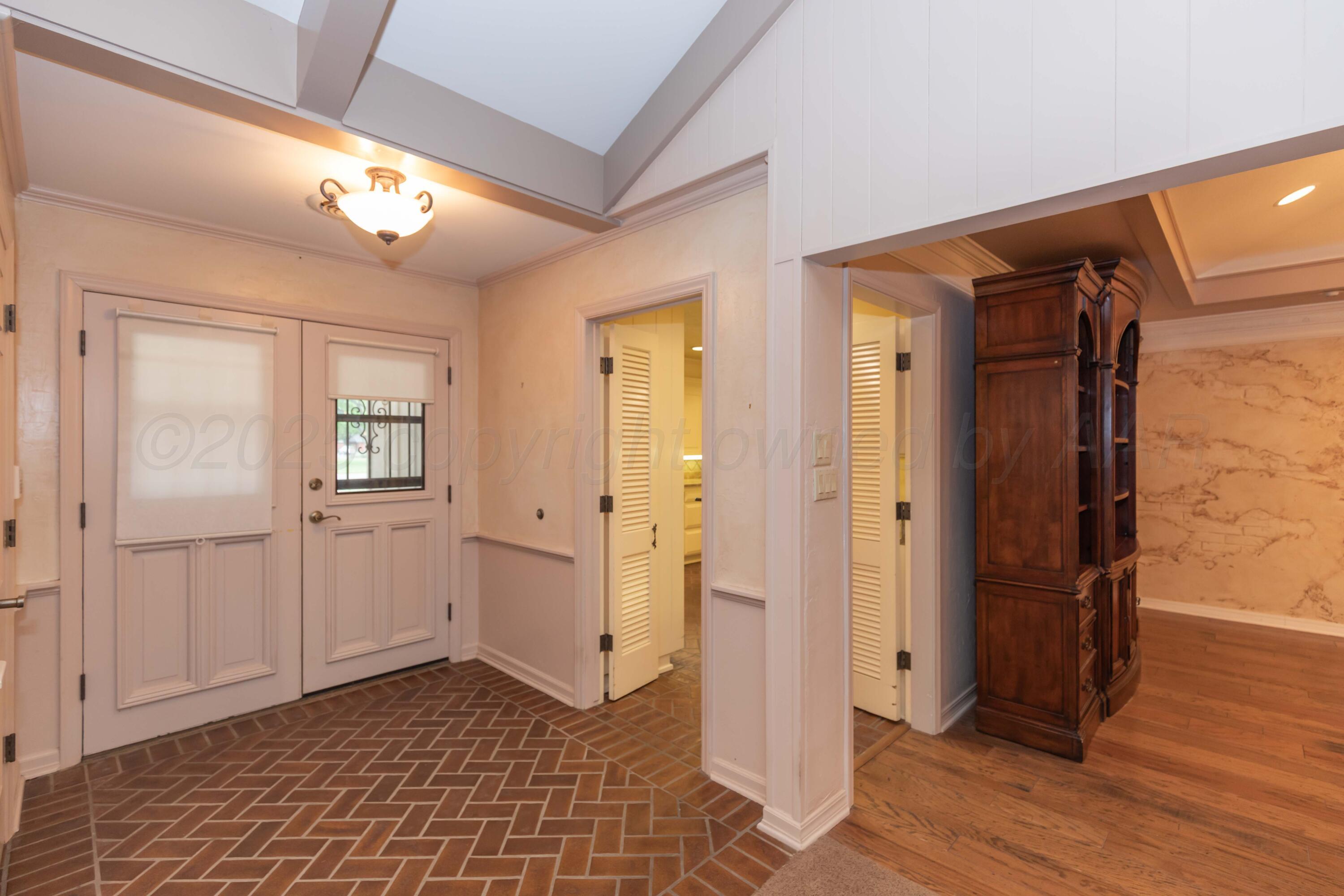 4102 Paramount Boulevard Amarillo, TX 79109 - Photo 38 of 73 a view of a hallway with wooden floor and closet area