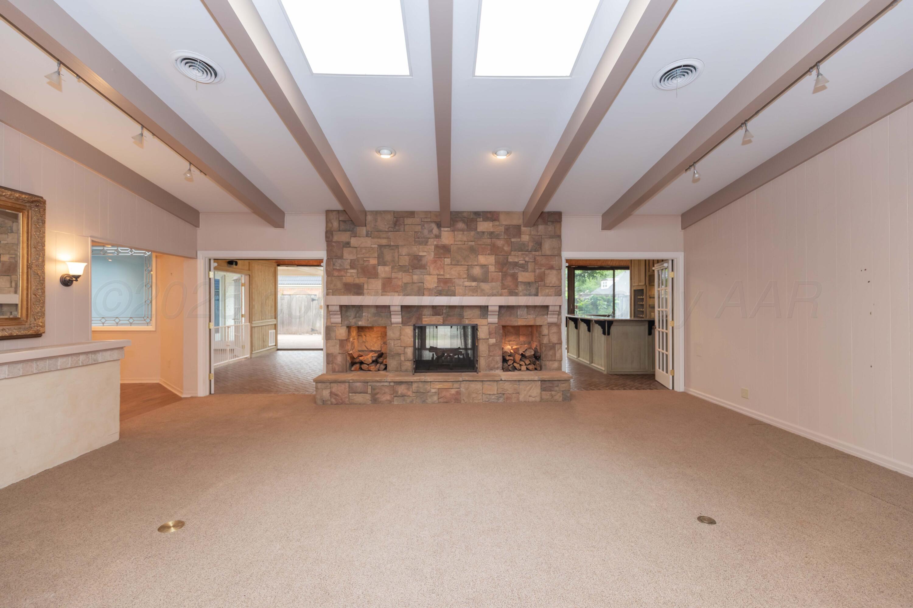 4102 Paramount Boulevard Amarillo, TX 79109 - Photo 55 of 73 a view of an empty room with a fireplace and a window