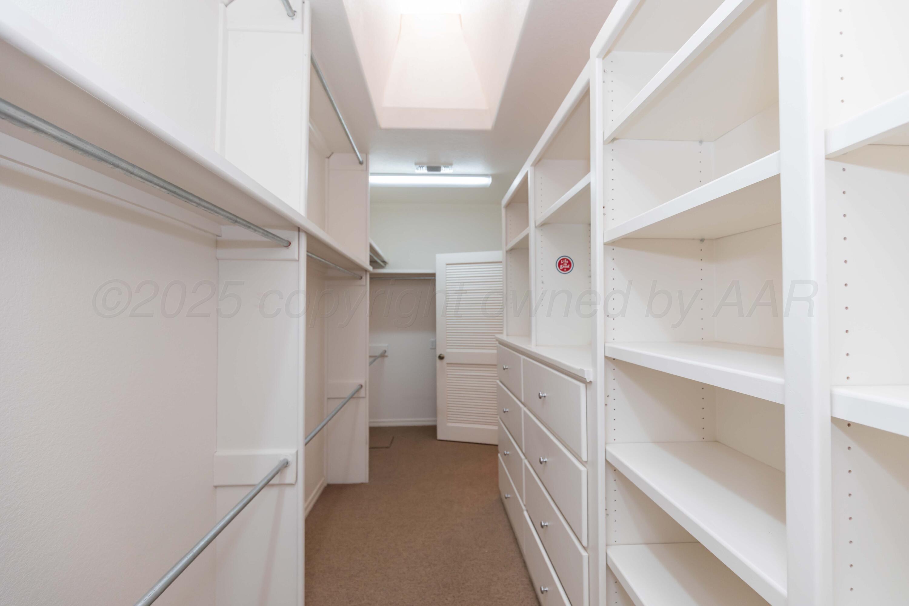 4102 Paramount Boulevard Amarillo, TX 79109 - Photo 66 of 73 a view of walk in closet with empty racks