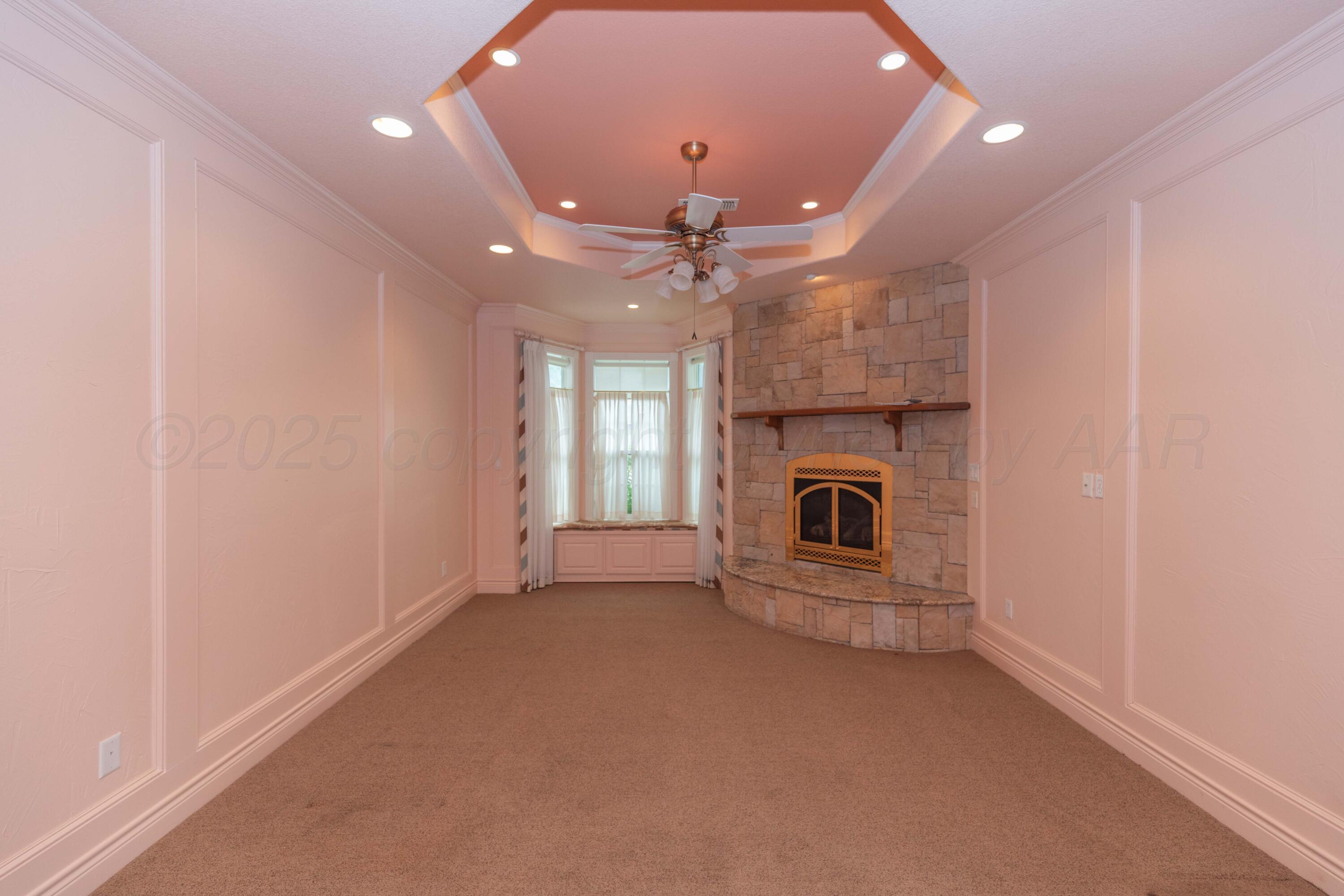 4102 Paramount Boulevard Amarillo, TX 79109 - Photo 70 of 73 an empty room with fireplace and windows