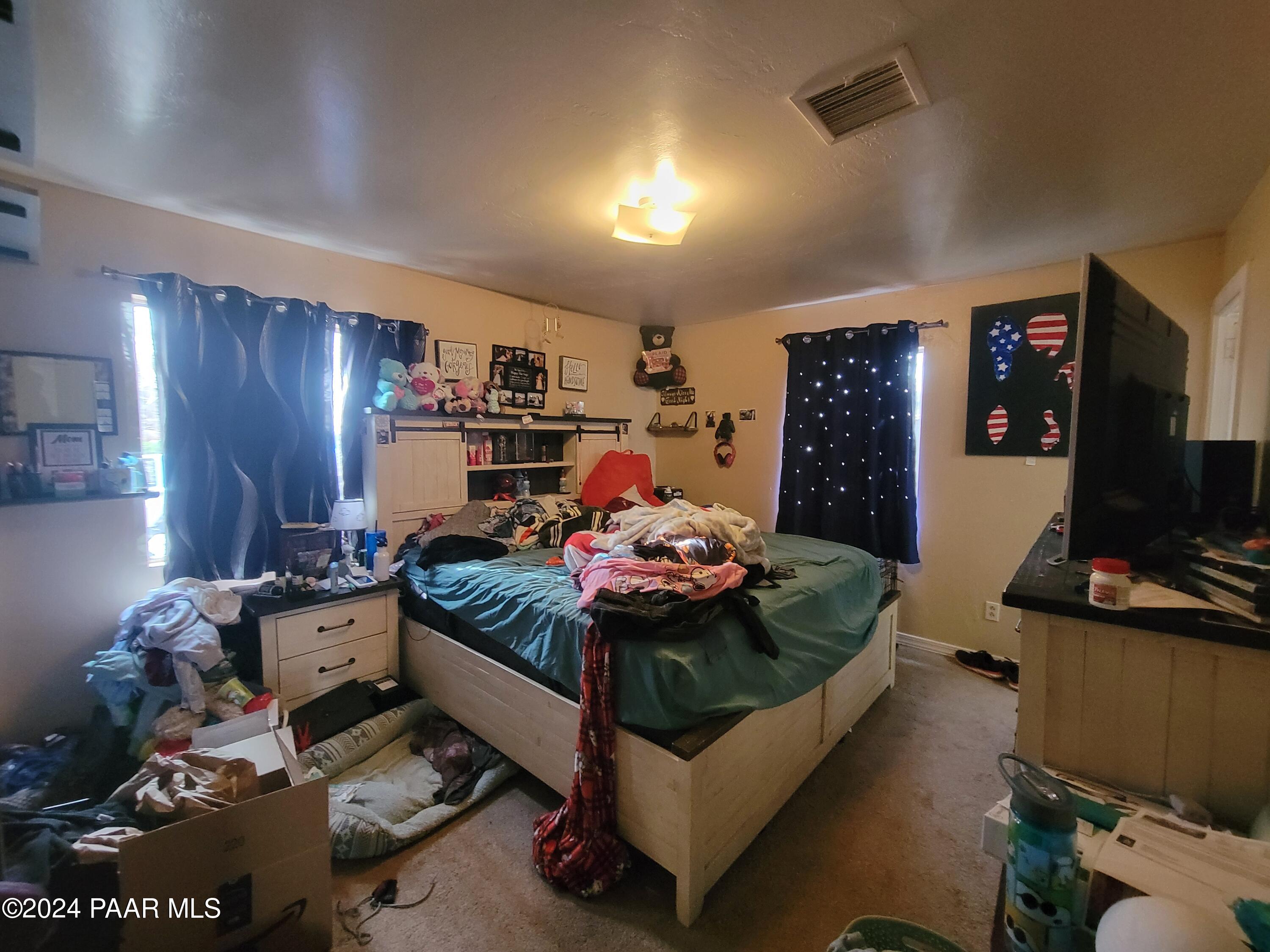 9840 Eighth Street Mayer, AZ 86333 - Photo 11 of 17 a living room with furniture and a flat screen tv
