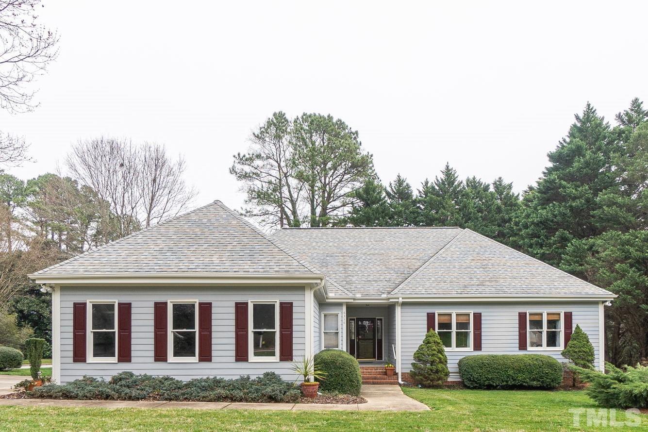6316 Ashley Ridge Drive Raleigh, NC 27612 - Photo 1 of 45 a aerial view of a white house next to a yard