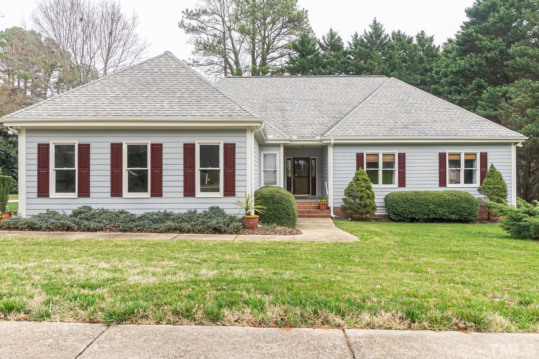 6316 Ashley Ridge Drive Raleigh, NC 27612 - Photo 2 of 45 a view of a house with a swimming pool
