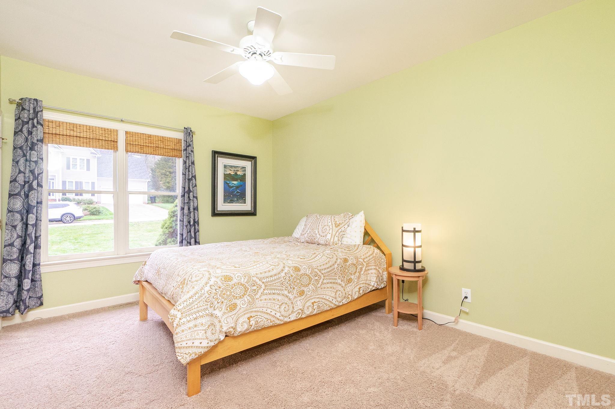 6316 Ashley Ridge Drive Raleigh, NC 27612 - Photo 23 of 45 a bedroom with a bed and a window