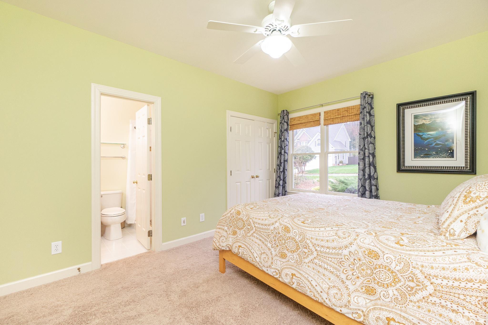 6316 Ashley Ridge Drive Raleigh, NC 27612 - Photo 24 of 45 a bedroom with a bed and a window