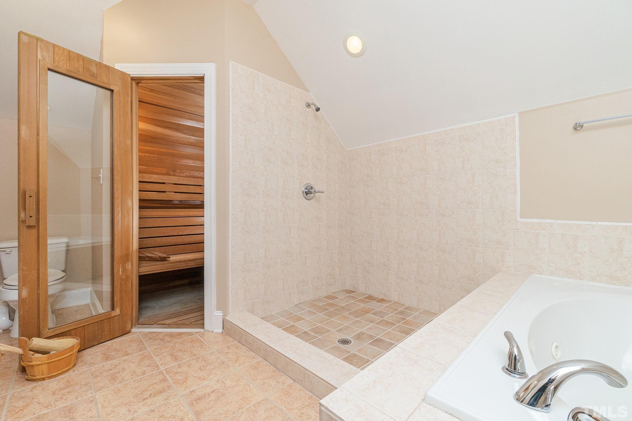 6316 Ashley Ridge Drive Raleigh, NC 27612 - Photo 31 of 45 a bathroom with a sink and a shower