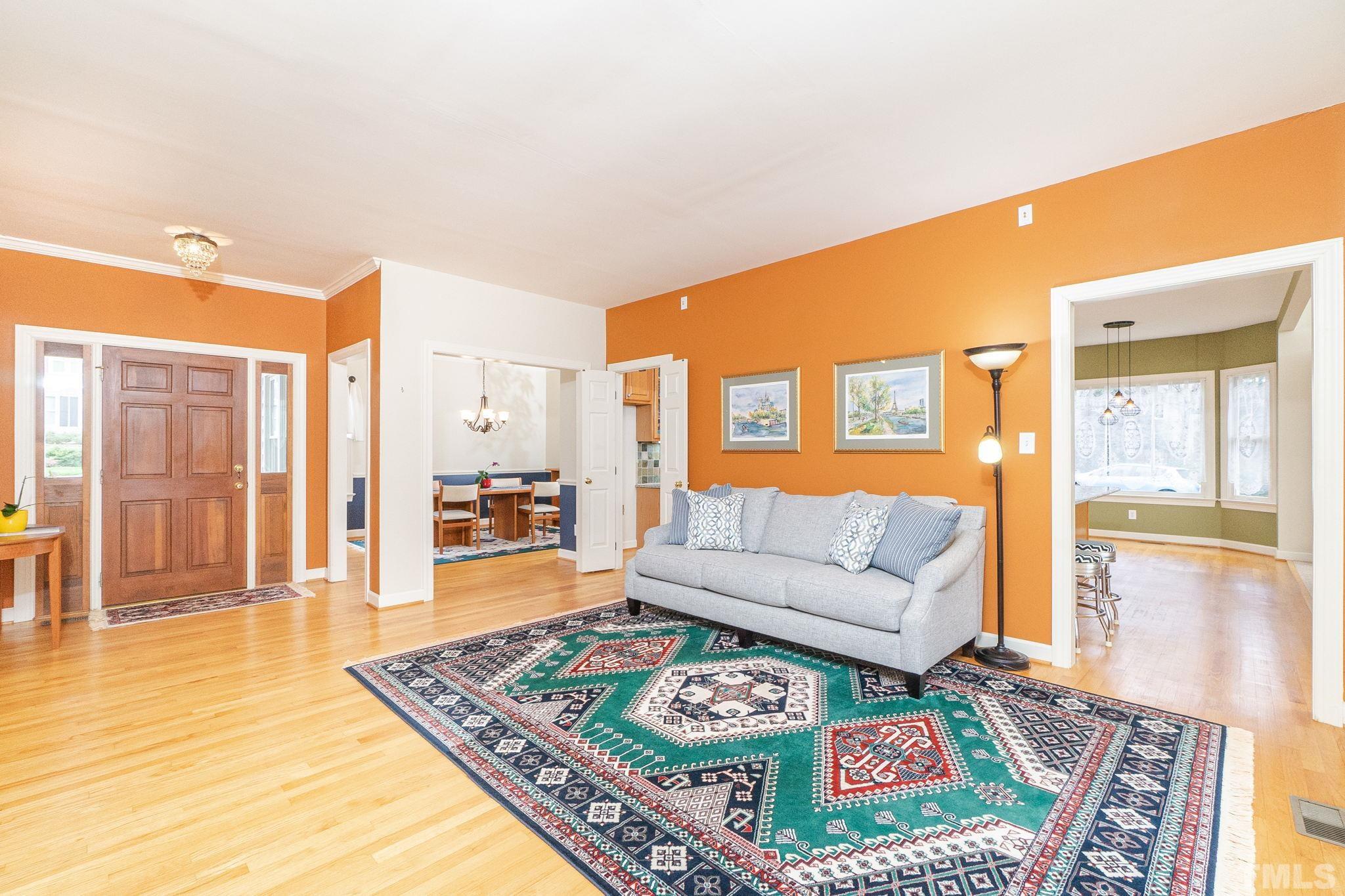 6316 Ashley Ridge Drive Raleigh, NC 27612 - Photo 6 of 45 a living room with furniture and a table