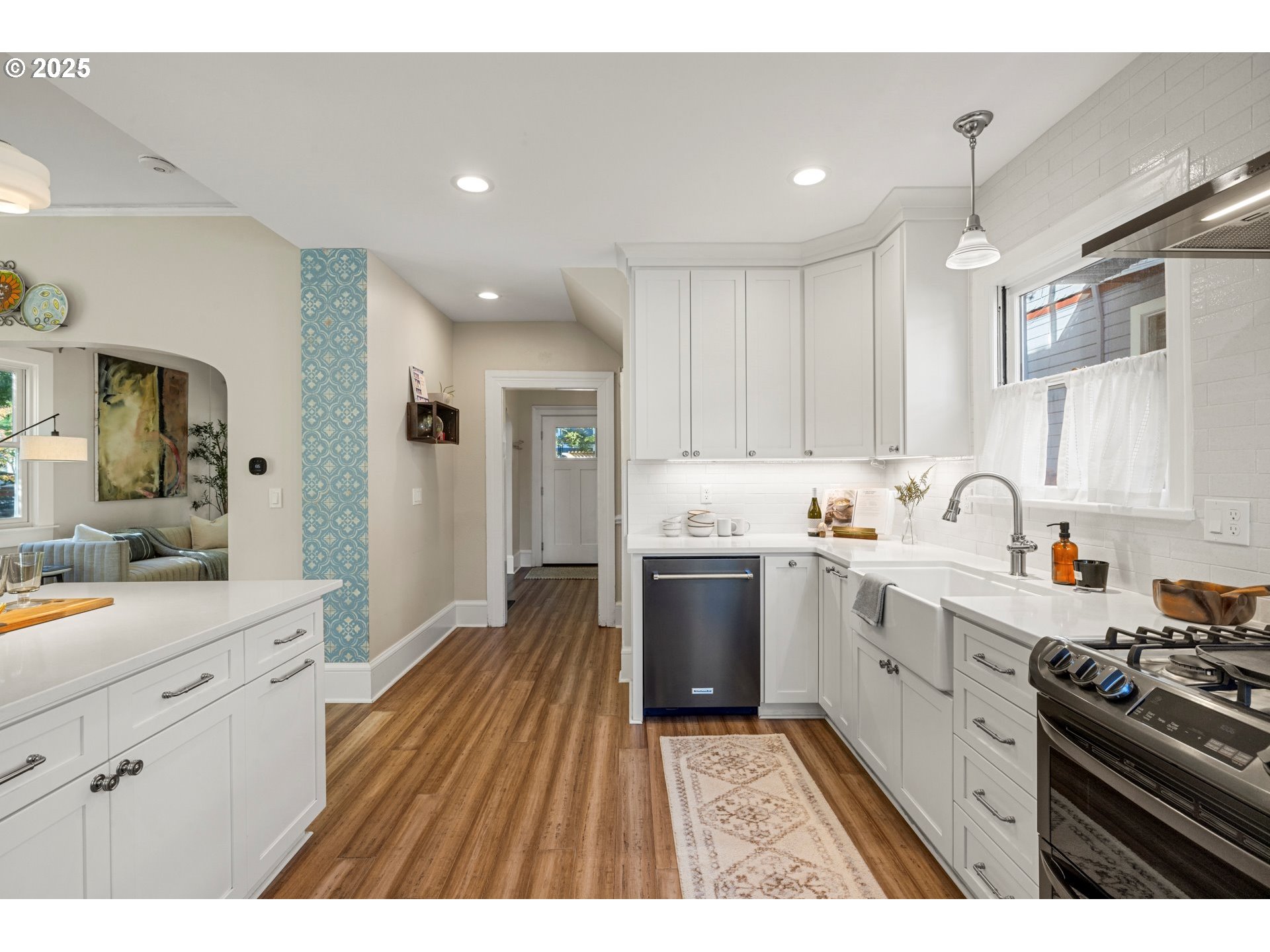 3312 South Corbett Avenue Portland, OR 97239 - Photo 20 of 48 a kitchen with sink stove and cabinets
