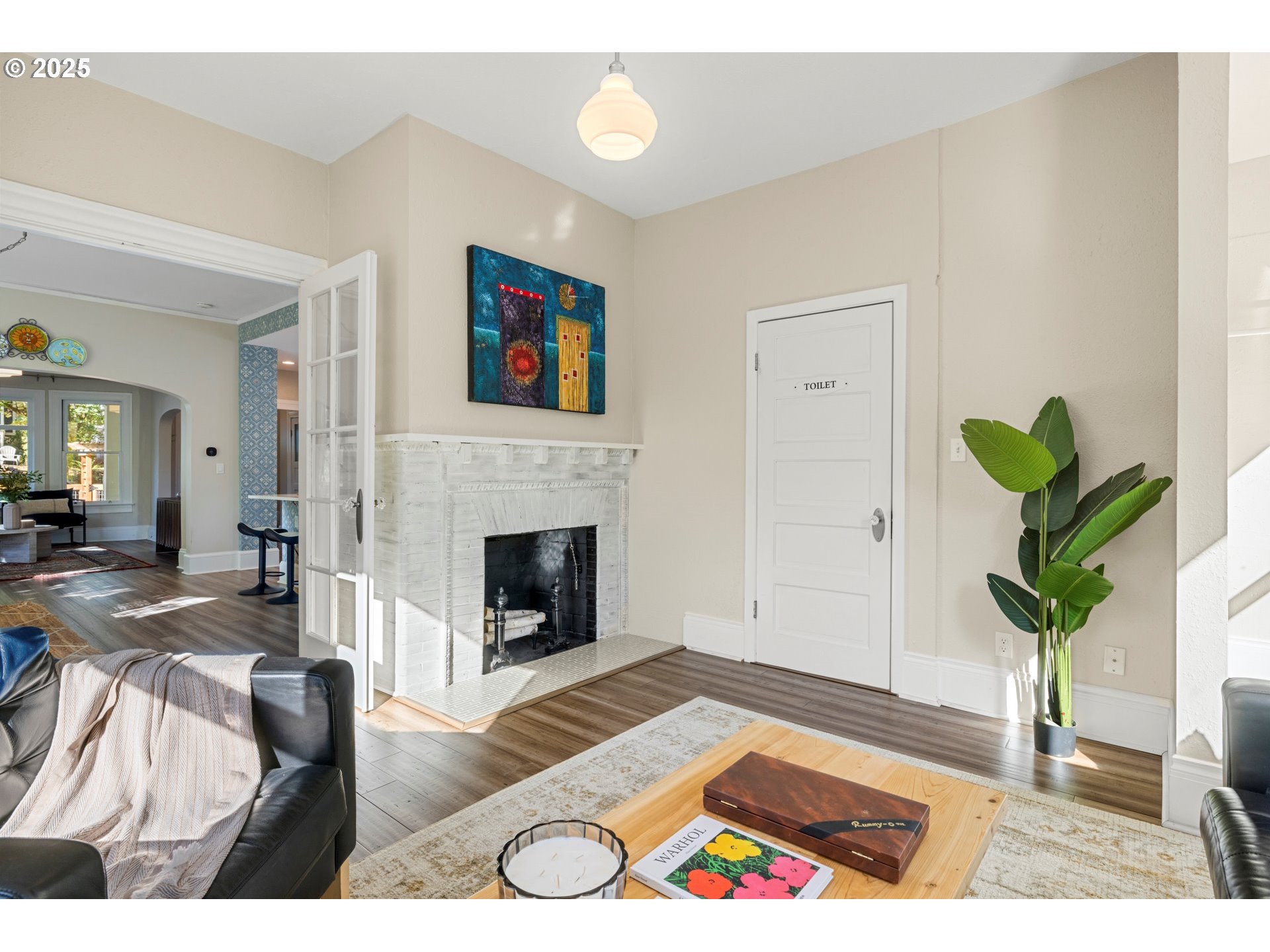 3312 South Corbett Avenue Portland, OR 97239 - Photo 24 of 48 a living room with furniture and a fireplace