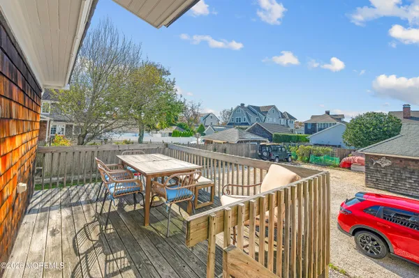 a view of a patio with table and chairs and potted plants