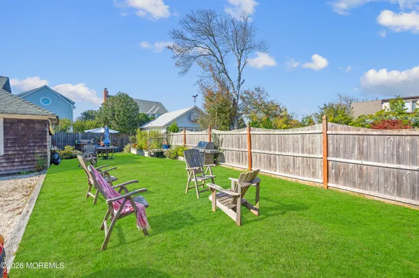 a view of a house with a yard porch and sitting area