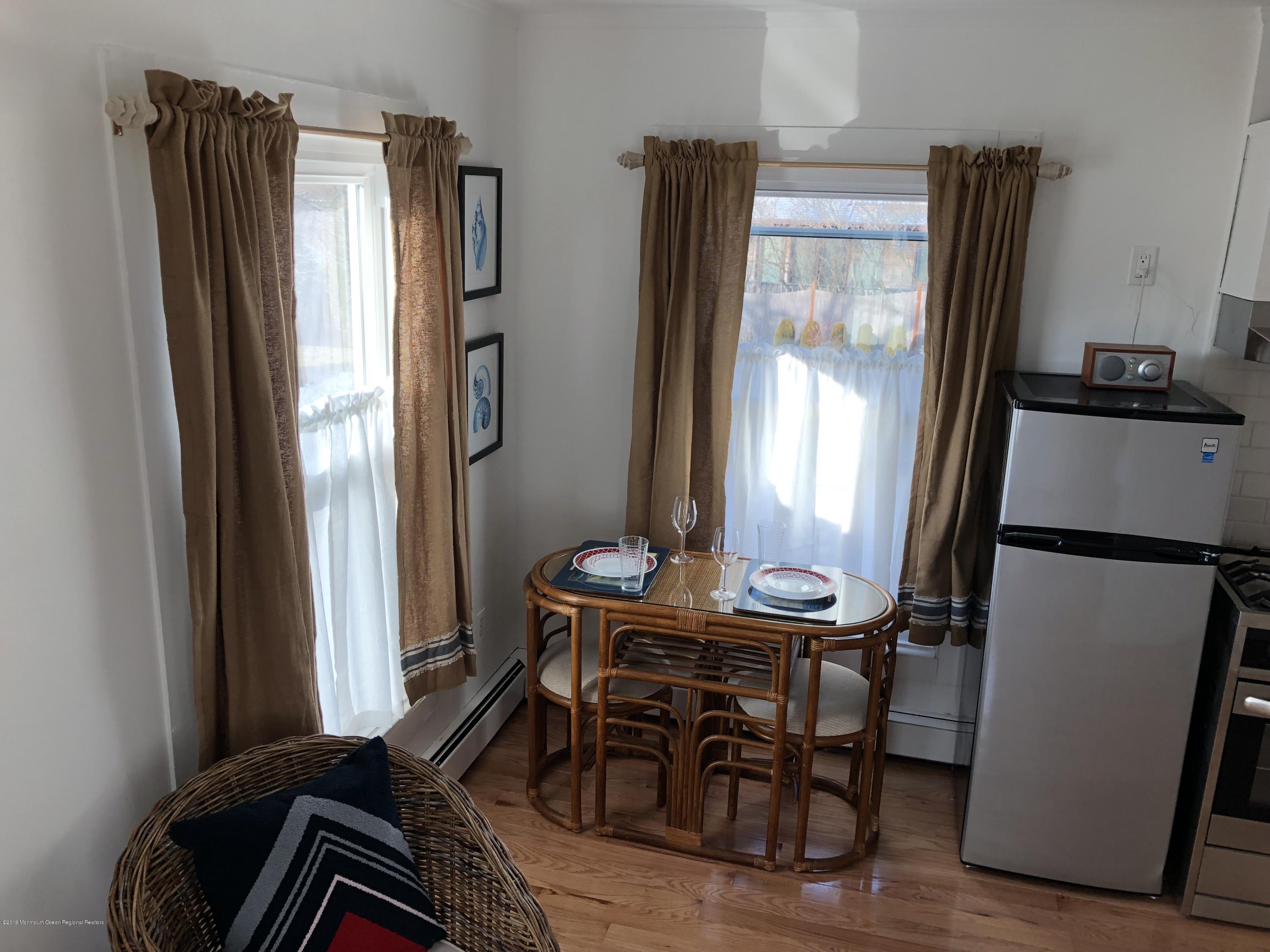 632 Main Avenue, Unit 5 Point Pleasant Beach, NJ 08742 - Photo 6 of 16 a dining room with furniture and window