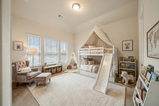 a kitchen with stainless steel appliances granite countertop a stove top oven a sink refrigerator and microwave