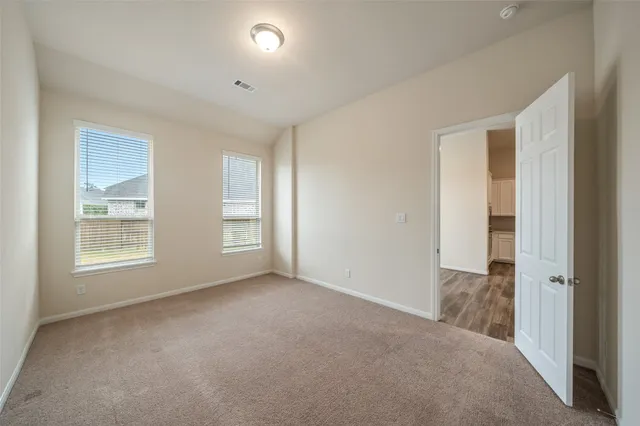 an aerial view of a house with a swimming pool