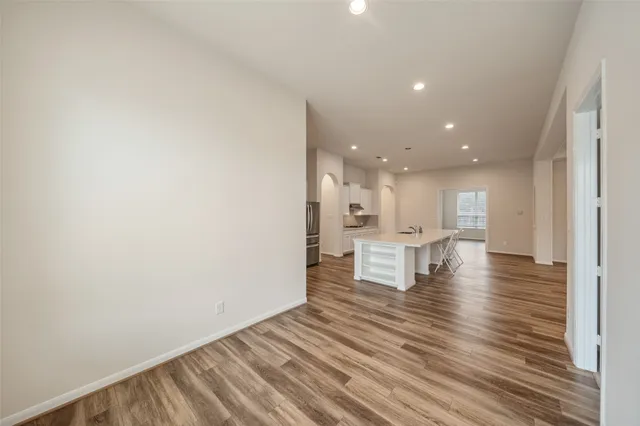 an aerial view of residential houses with outdoor space and swimming pool