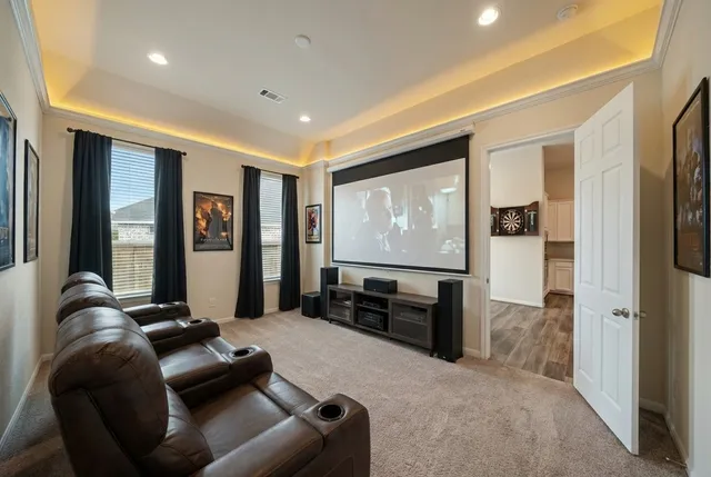 a spacious bedroom with a bed and a large window