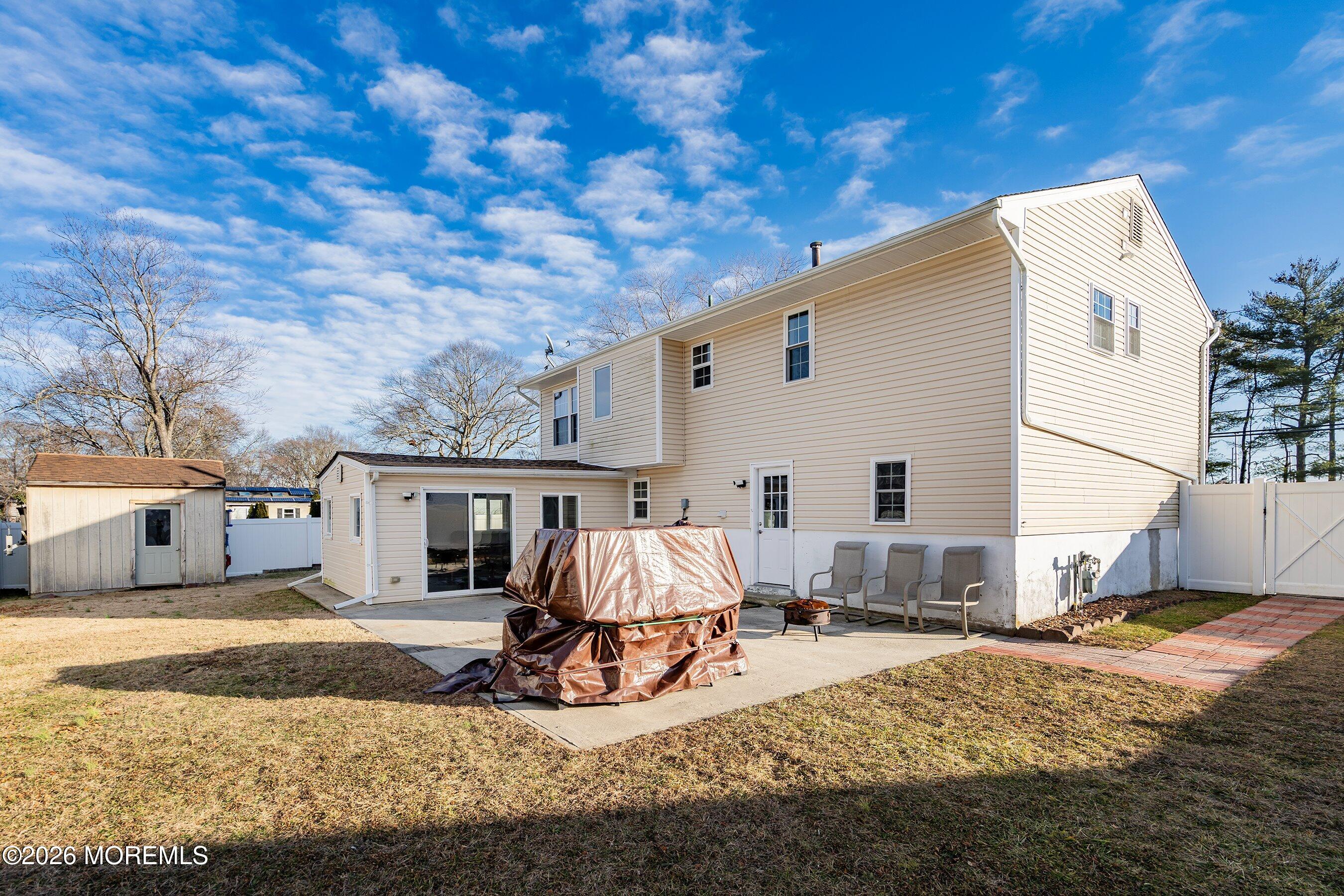 636 Hill Road Toms River, NJ 08753 - Photo 27 of 31 a view of house with yard and seating area