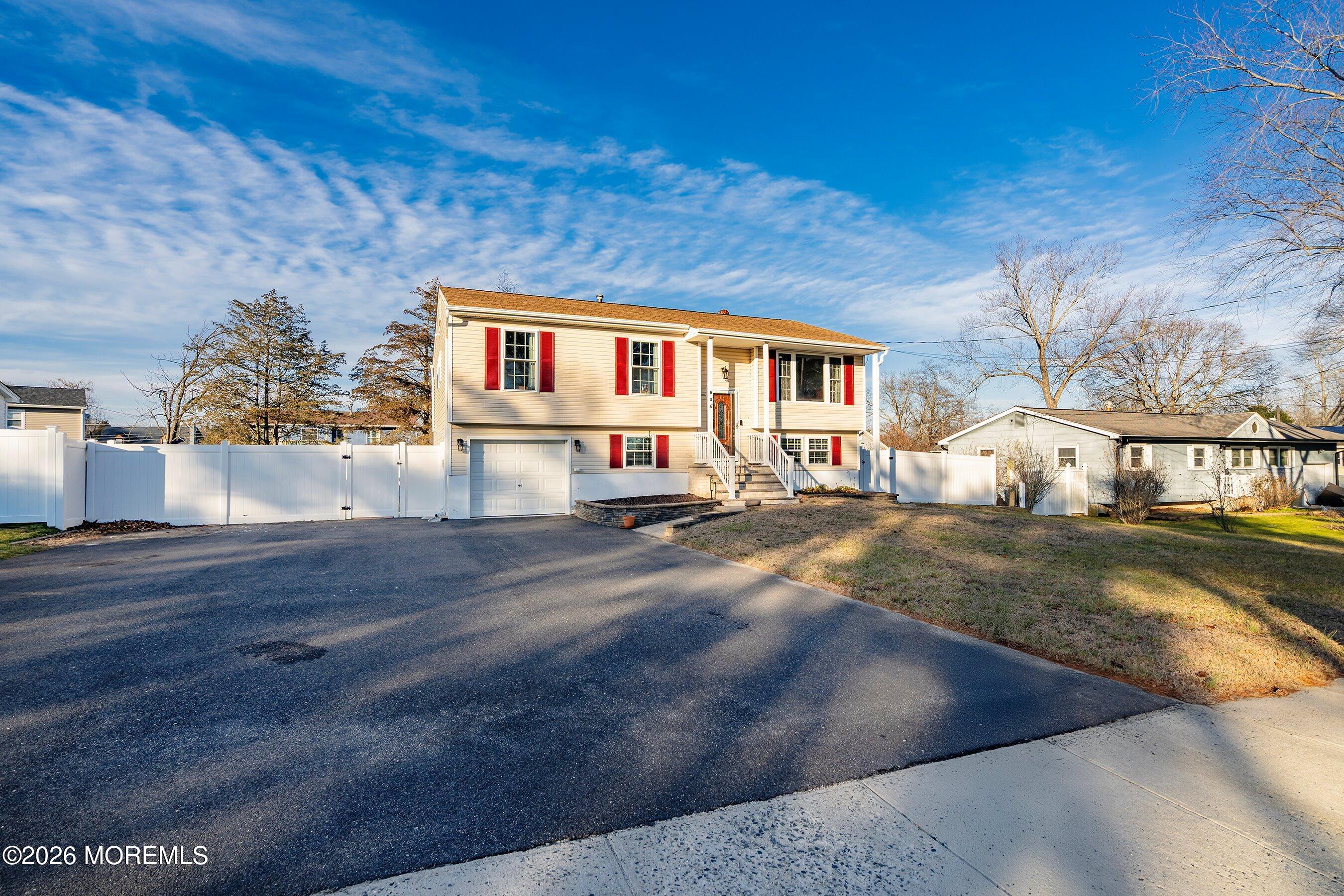636 Hill Road Toms River, NJ 08753 - Photo 3 of 31 a front view of a house with a yard