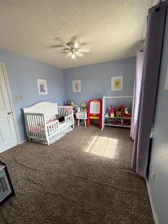 a view of a livingroom with furniture and toys