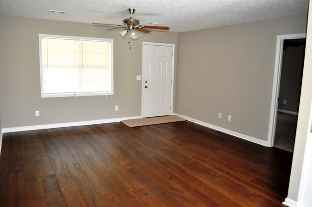 48 Ramsey Road Phenix City, AL 36869 - Photo 12 of 23 wooden floor in an empty room with a window