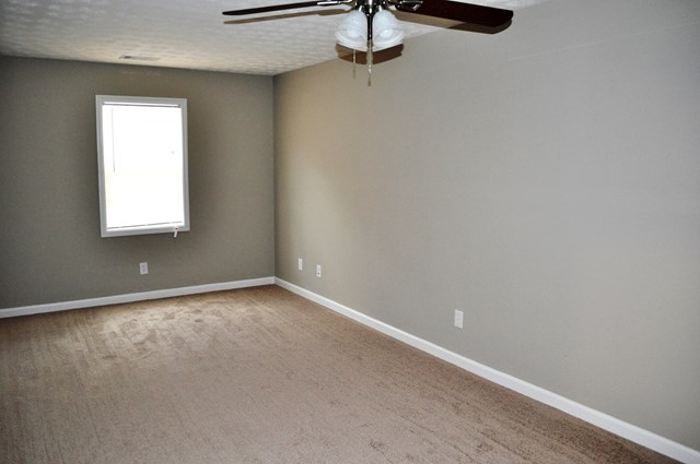 48 Ramsey Road Phenix City, AL 36869 - Photo 18 of 23 an empty room with a window and a fan