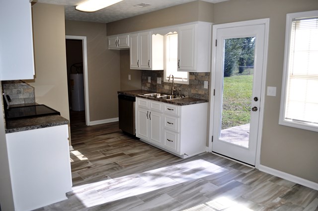 48 Ramsey Road Phenix City, AL 36869 - Photo 6 of 23 a kitchen with stainless steel appliances granite countertop a stove a sink and a refrigerator
