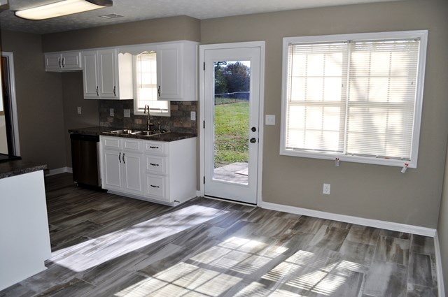 48 Ramsey Road Phenix City, AL 36869 - Photo 10 of 23 a kitchen with a refrigerator and windows