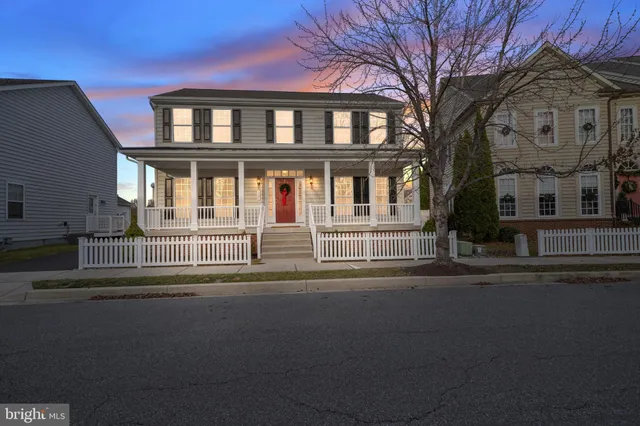 a front view of a residential apartment building with a street