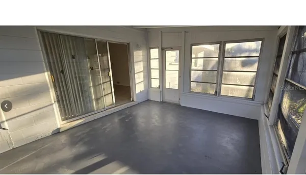 an empty room with windows