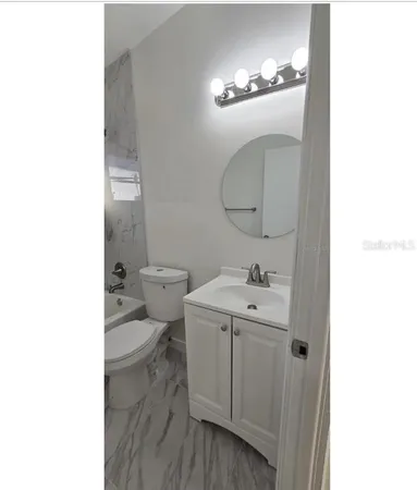 a bathroom with a sink and a toilet