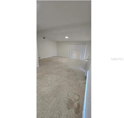 a view of a room with a white wall and a white wall