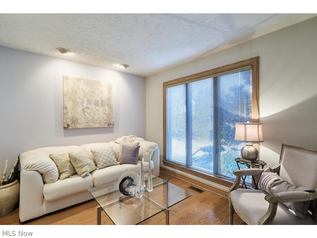 875 Hunter Ridge Circle Fairlawn, OH 44333 - Photo 6 of 34 Den is the right of foyer and has hardwood floors