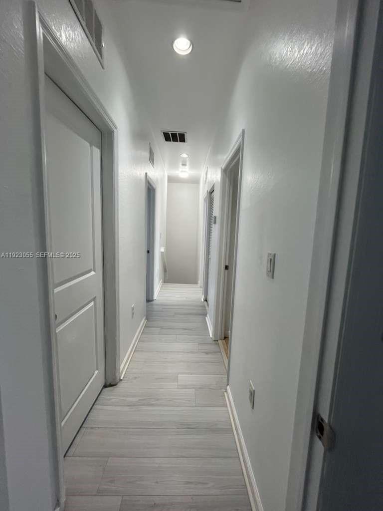 11665 Southwest 244 Street, Unit 116 Homestead, FL 33032 - Photo 13 of 32 a view of a hallway