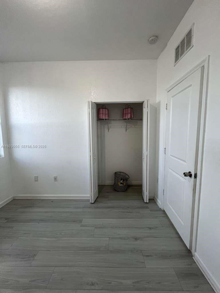 11665 Southwest 244 Street, Unit 116 Homestead, FL 33032 - Photo 23 of 32 a view of an empty room