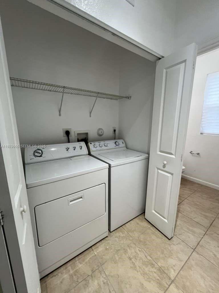 11665 Southwest 244 Street, Unit 116 Homestead, FL 33032 - Photo 7 of 32 a utility room with dryer and washer