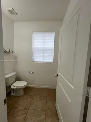 a bathroom with a toilet