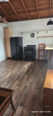 a room with wooden floor and a window