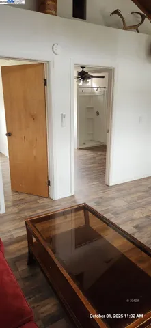 a view of room with window and wooden floor