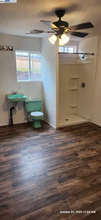 a view of room with wooden floor