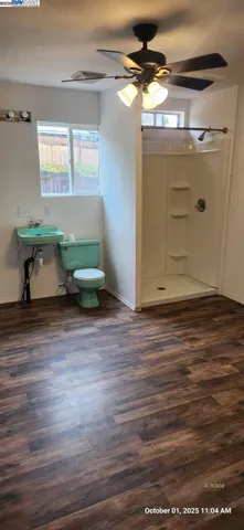 a view of room with wooden floor