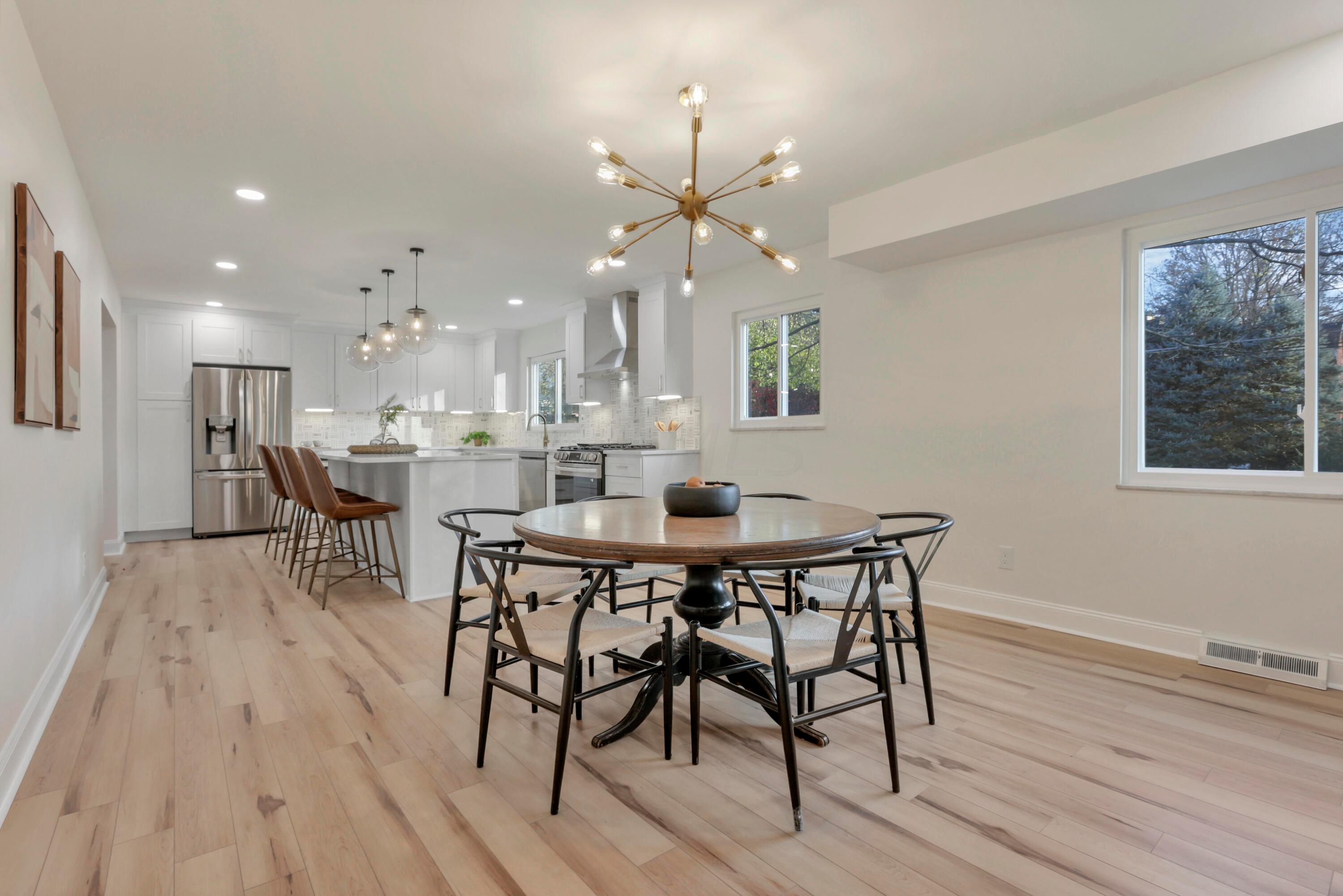 2275 Haverford Road Columbus, OH 43220 - Photo 13 of 57 Open dining area and family room for seamless entertaining.