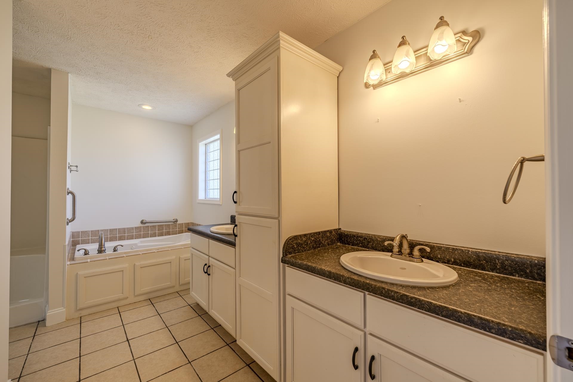 200 Boyd Road Adamsville, TN 38310 - Photo 13 of 26 a bathroom with a sink double vanity granite and a mirror