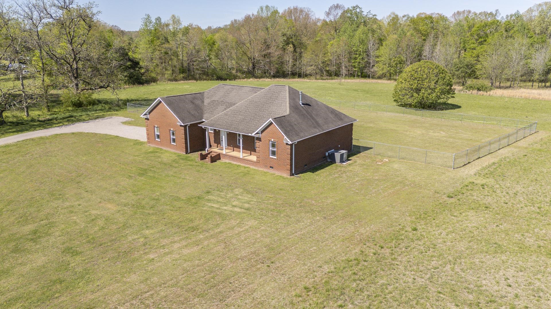 200 Boyd Road Adamsville, TN 38310 - Photo 2 of 26 a view of a house with a yard and mountain