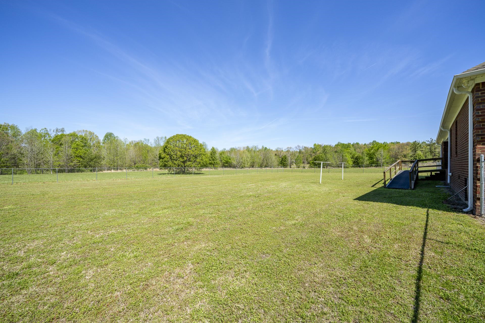 200 Boyd Road Adamsville, TN 38310 - Photo 21 of 26 a view of a lake with a yard