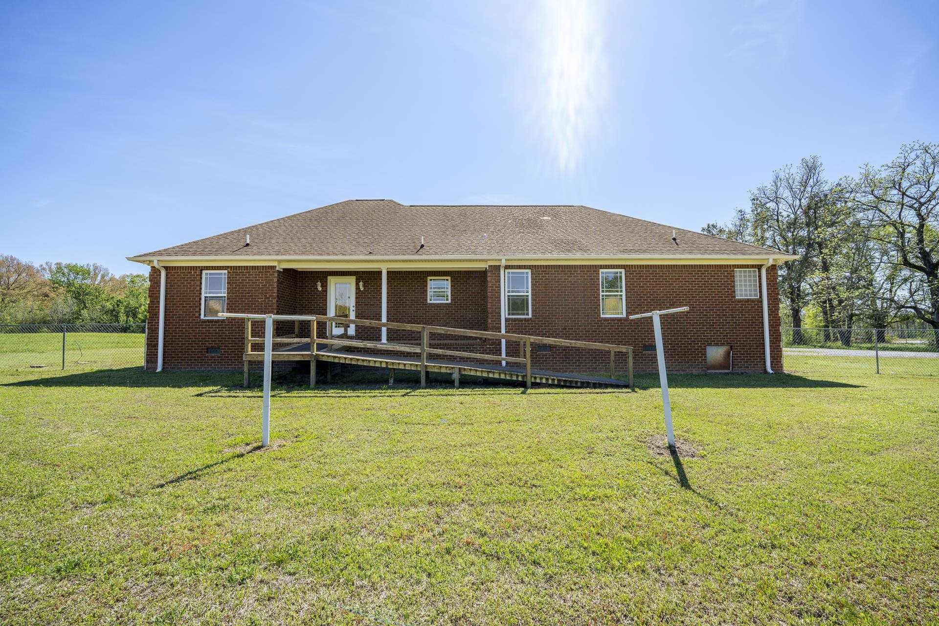200 Boyd Road Adamsville, TN 38310 - Photo 23 of 26 a view of a house with swimming pool and a yard
