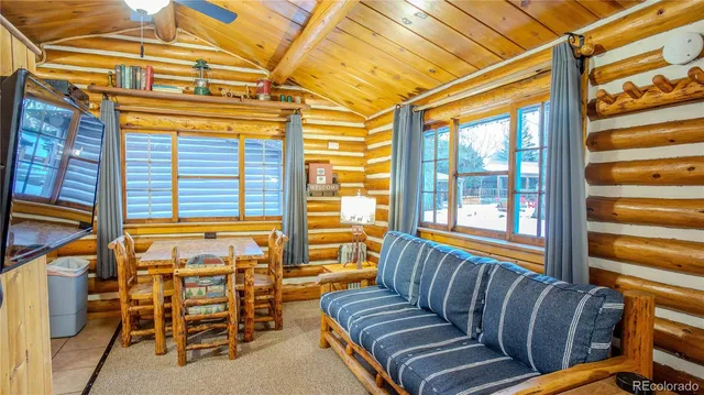 a view of a living room and a balcony