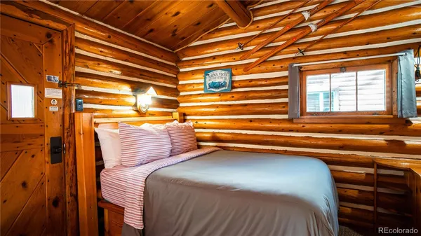 a bedroom with a bed and a cabinets