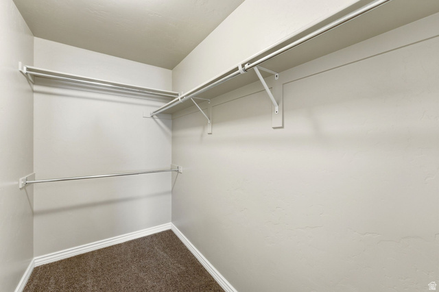 7235 Viansa Court Midvale, UT 84047 - Photo 21 of 43 Walk in closet with dark colored carpet